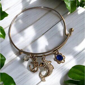 Brushed Gold-Tone Metal Charm Bangle With Dolphin Anchor Flower & Crystal Bead